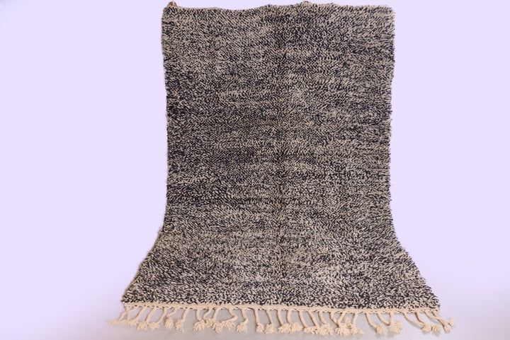 Front view of the lilac Beni Ourain Moroccan rug featuring an abstract pattern and fringe edges.