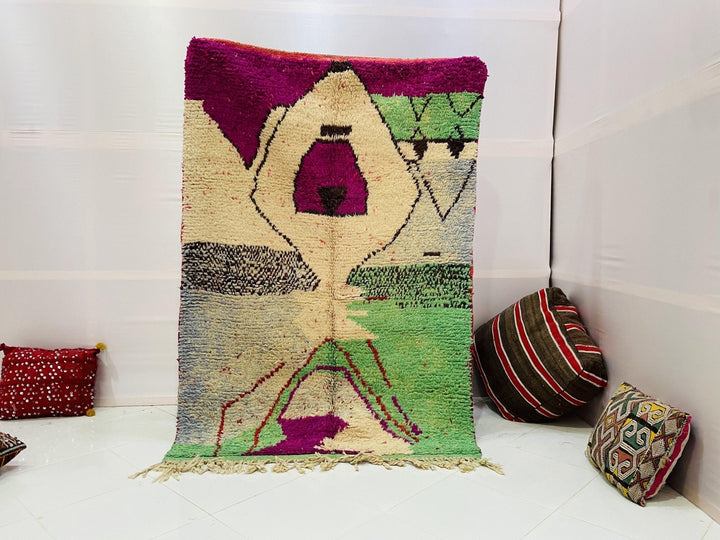 Front view of the purple and green Moroccan Boujaad rug with tribal design on a white background.
