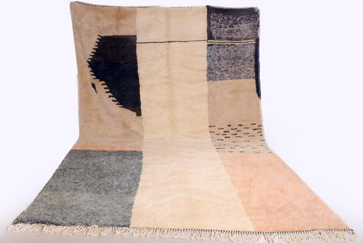 Lifestyle shot of the black and cream Tizi N'Test Moroccan rug with geometric patterns.