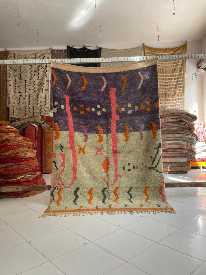 Front view of the purple vintage Boujaad Moroccan rug with tribal patterns and fringe edges.