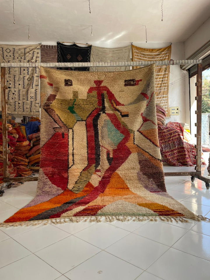 Lifestyle shot of a colorful Moroccan rug with a faded design on a natural background.