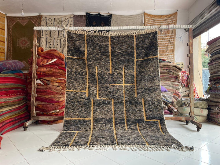 Lifestyle shot of a faded turquoise Beni Ourain Moroccan rug with geometric pattern.