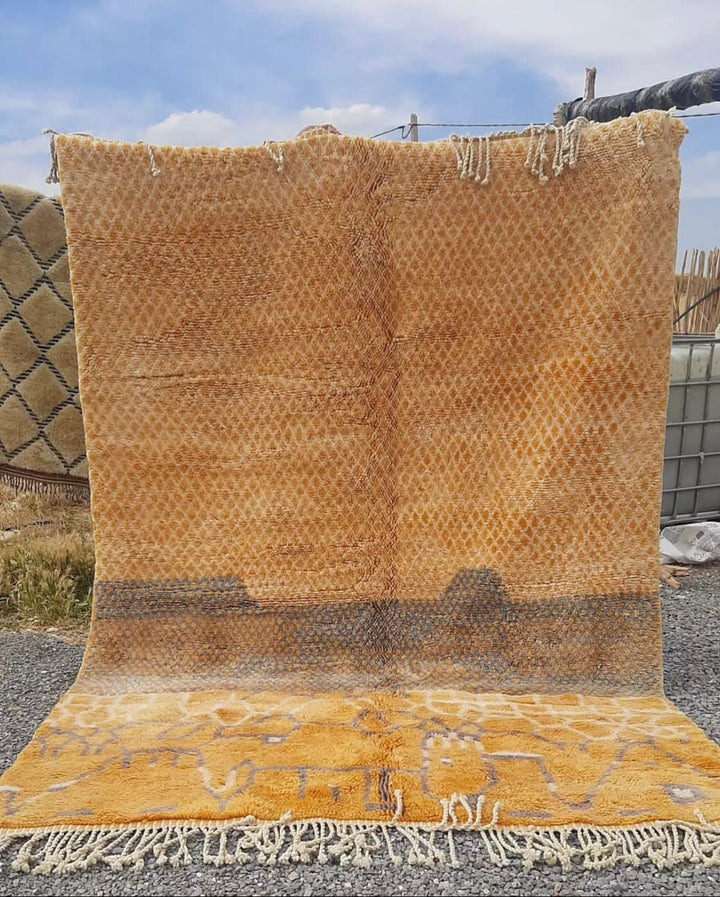 Front view of the orange Moroccan rug featuring geometric patterns and fringe edges.