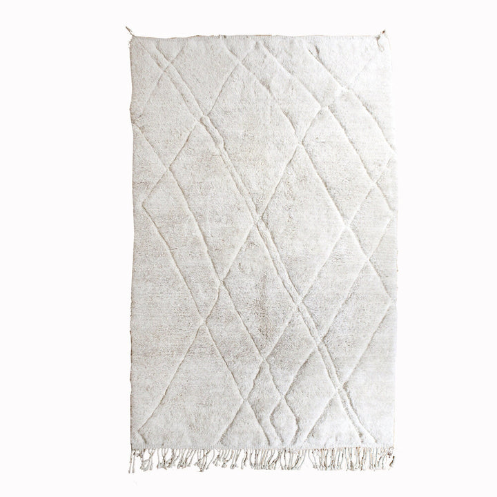 Front view of a textured abstract Beni Ourain Moroccan rug in black and off-white.