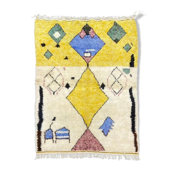 Front view of a blue and yellow tribal Azilal rug featuring geometric patterns.