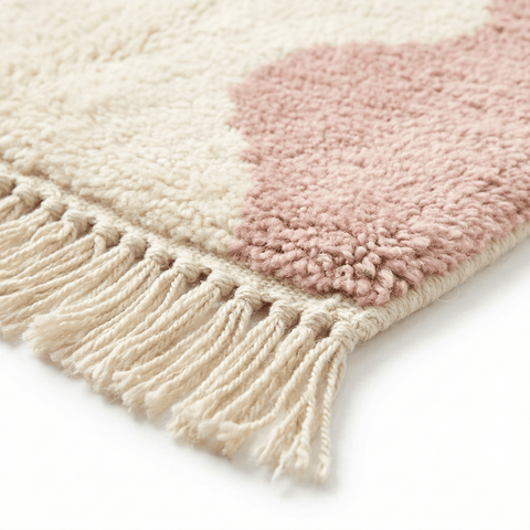 Lifestyle view of a baby pink Moroccan rug showcasing its design in a natural background.
