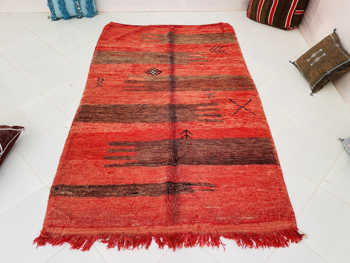 Front view of the red vintage Boujaad Moroccan rug featuring a striped design and fringe edges.