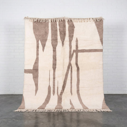 Front view of a beige taupe modern Moroccan rug showcasing its design against a white background.