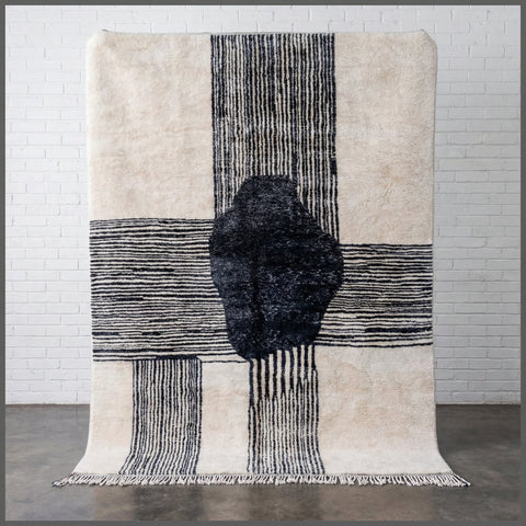Front view of a black and white Moroccan rug showcasing a modern design.