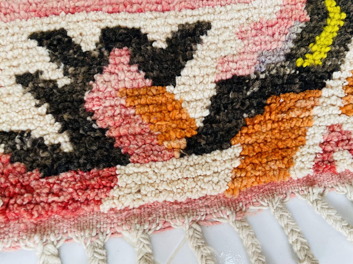 Lifestyle angle of the orange abstract Moroccan rug featuring its vibrant abstract design.