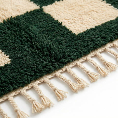 Front view of the checkered green rug showcasing its checkered design in green and beige.