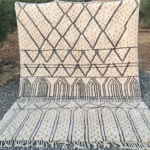 Front view of a cream checkered Moroccan rug featuring geometric patterns and fringe edges.