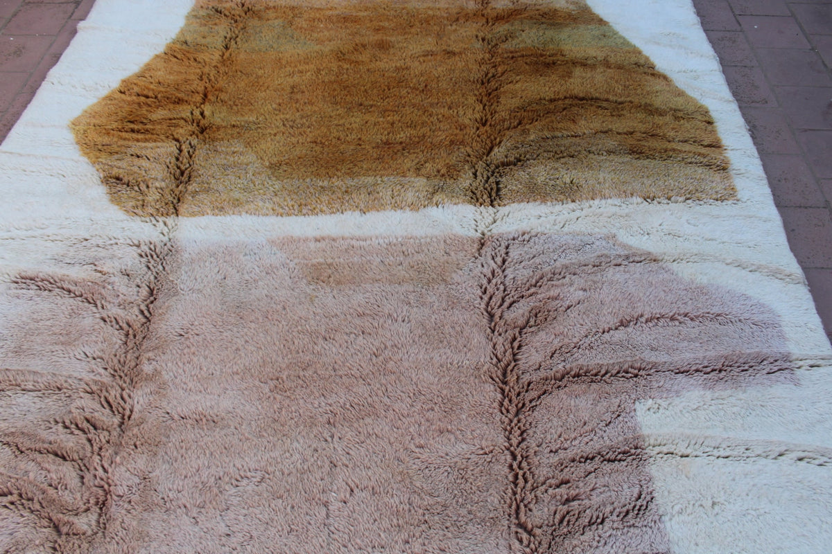 Detail close-up of the brown and cream Moroccan Mrirt rug with a striped design.