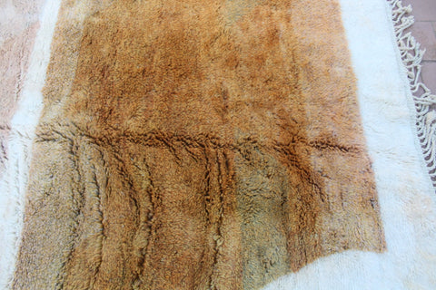 Detail close-up of the brown and cream Moroccan Mrirt rug with a textured pattern.