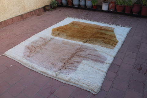 Detail close-up of the brown and cream Moroccan Mrirt rug with a textured pattern.