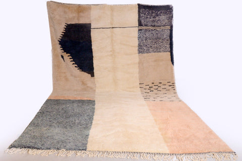 Lifestyle shot of the black and cream Tizi N'Test Moroccan rug with geometric patterns.