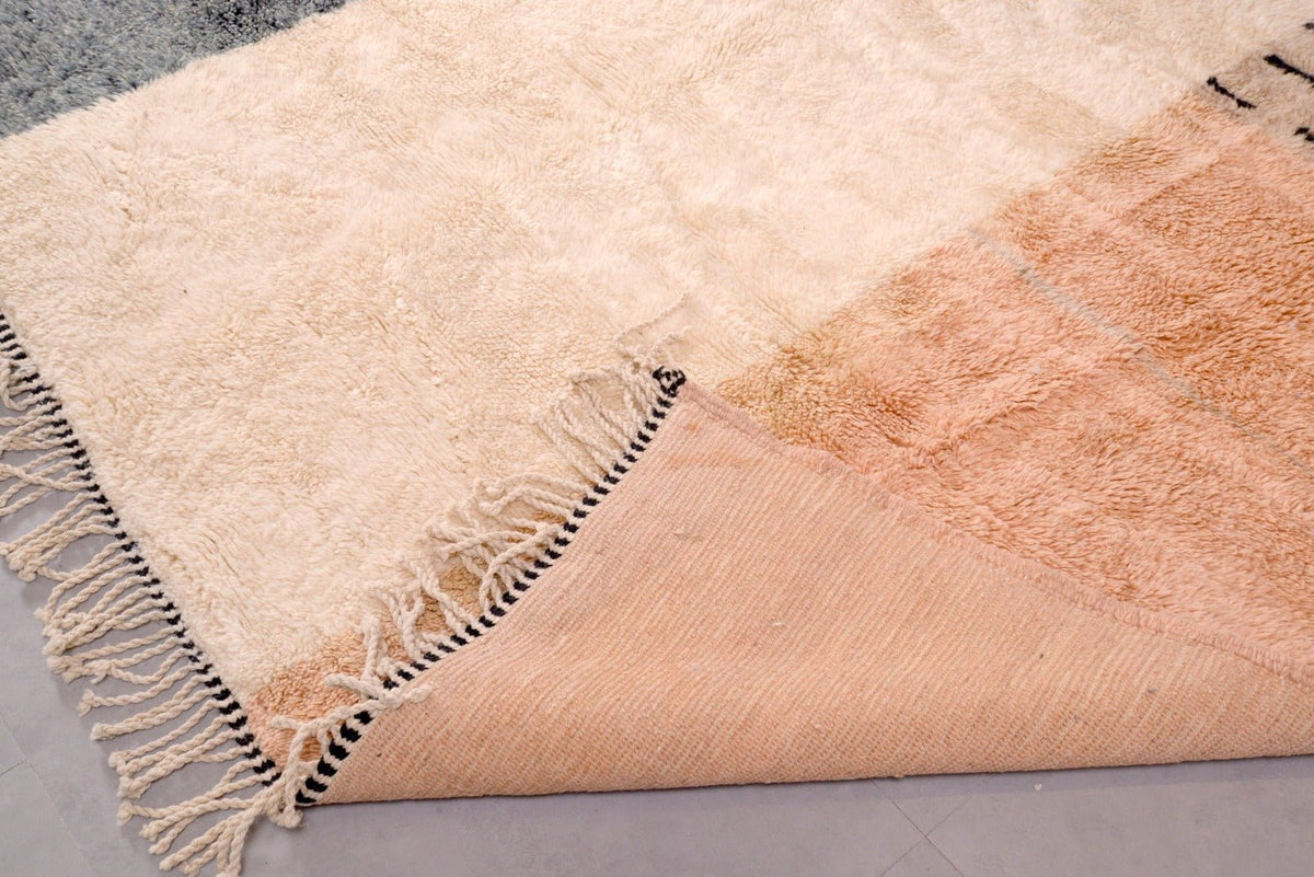 Detail shot showing the soft texture and fringe edges of the Tizi N'Test Moroccan rug.