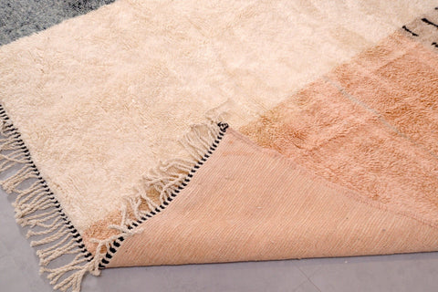 Detail shot showing the soft texture and fringe edges of the Tizi N'Test Moroccan rug.