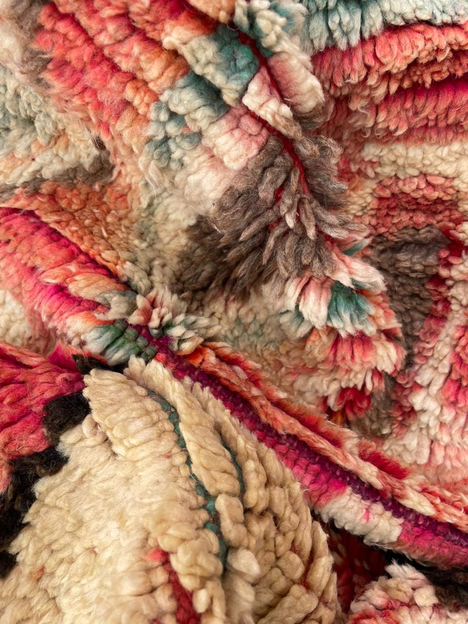 Detail view of intricate designs and colorful patterns on a vintage Moroccan rug.