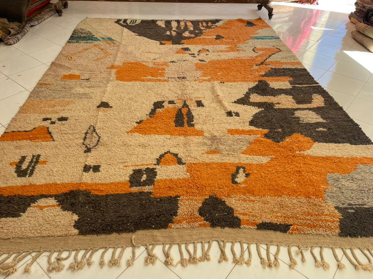 Close-up detail of a vintage Moroccan rug showcasing an abstract design with a textured surface.