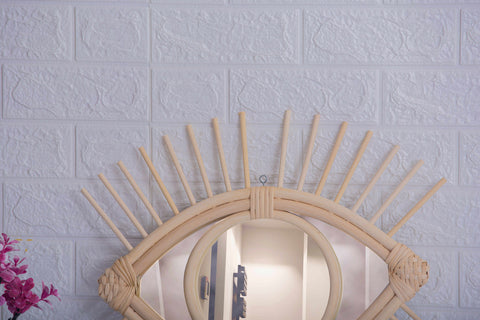 Miroir en oeil de rotin