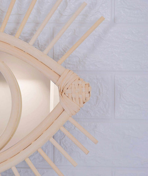 Miroir en oeil de rotin