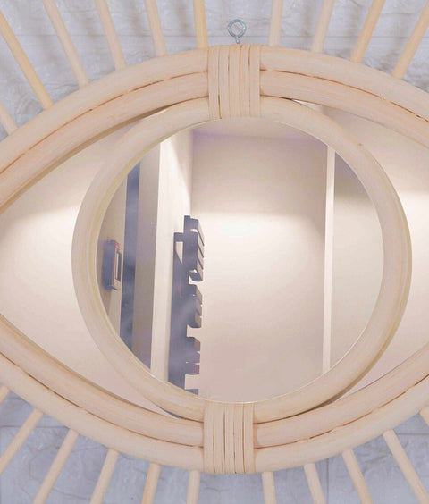 Miroir en oeil de rotin