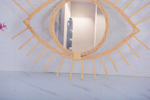 Miroir en oeil de rotin