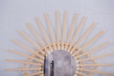 Miroir en oeil de rotin