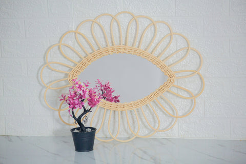 Miroir en oeil de rotin