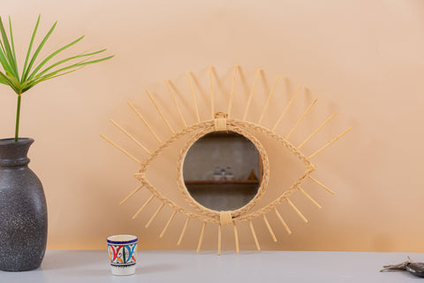 Miroir en oeil de rotin