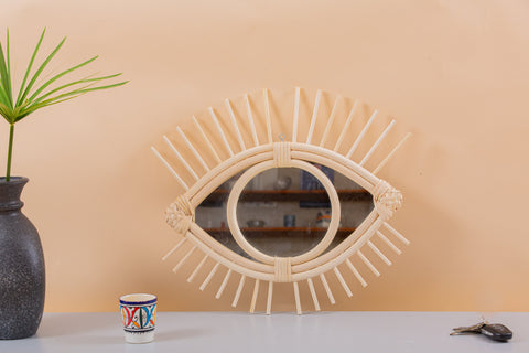 Miroir en oeil de rotin