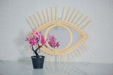 Miroir en oeil de rotin