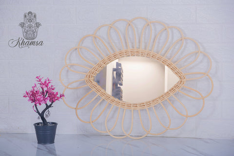 Miroir en oeil de rotin