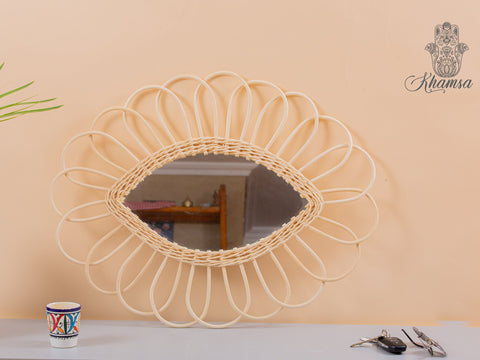 Miroir en oeil de rotin