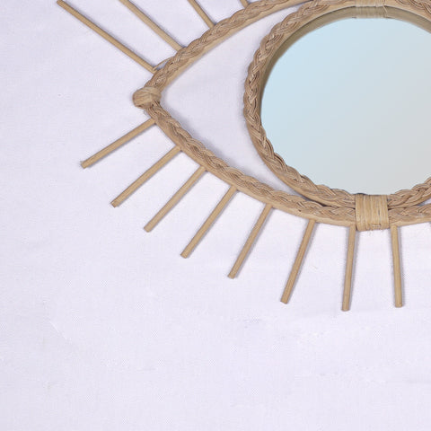 Miroir en oeil de rotin
