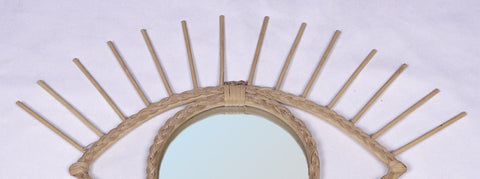 Miroir en oeil de rotin