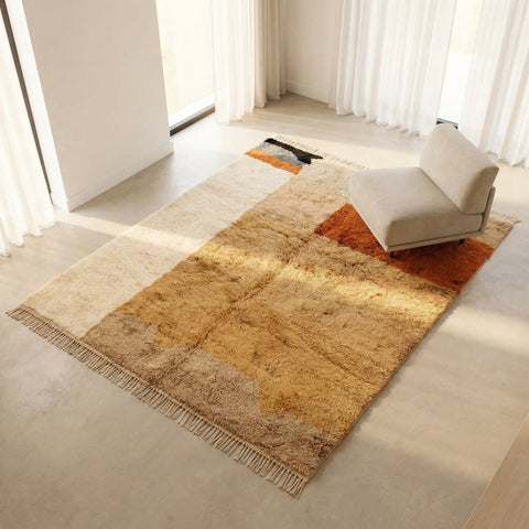 Lifestyle shot of the Moroccan rug in a natural setting, showcasing its warm colors and geometric design.