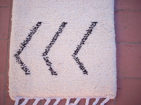 Detail close-up of the black and white Beni Ourain runner rug showcasing geometric patterns.