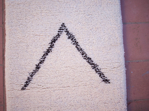 Detail close-up of the black and white Beni Ourain runner rug emphasizing its geometric design.