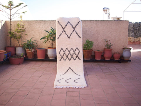 Lifestyle shot of the black and white Beni Ourain runner rug with geometric patterns.