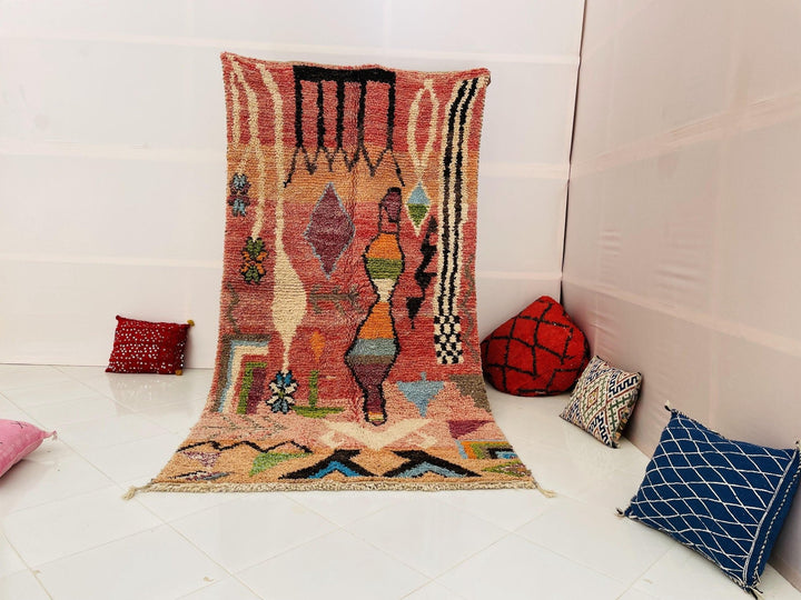 Lifestyle shot of the Tribal Abstract Vintage Boujaad Moroccan Rug featuring red, orange, and blue colors.