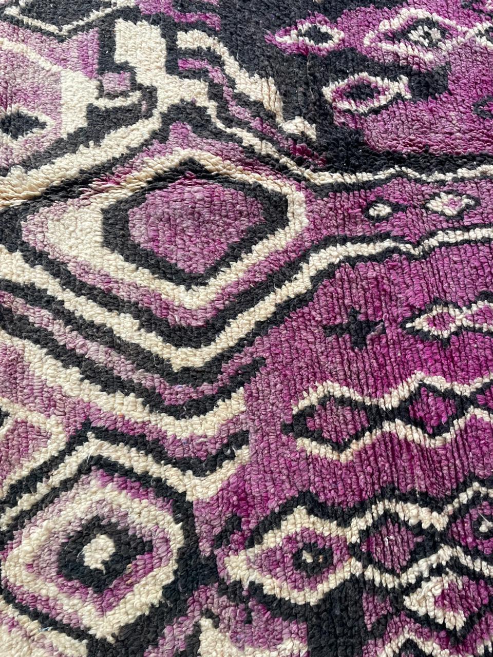 Close-up detail of the vintage wool rug featuring intricate design and soft fibers.