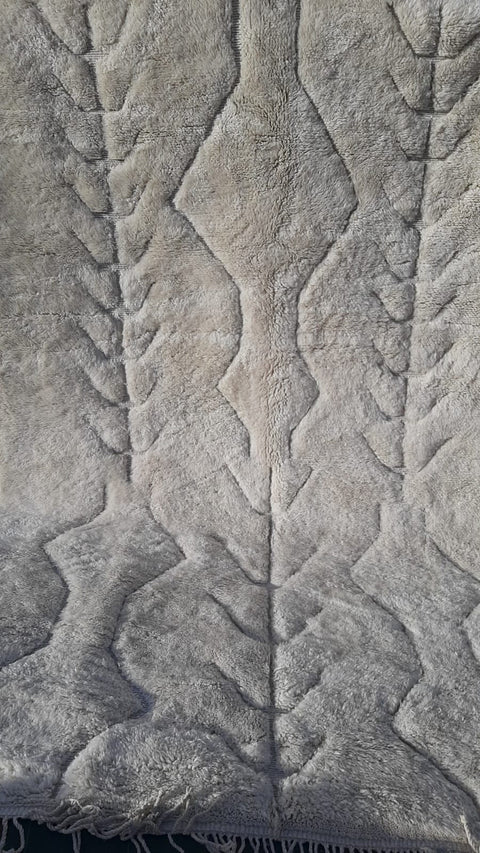 Close-up of the intricate design and soft texture of a Moroccan Mrirt rug.