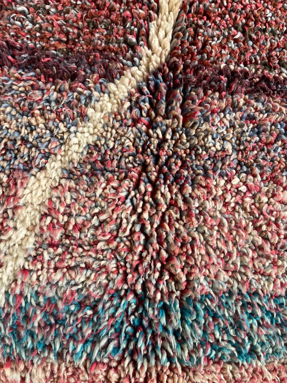 Detail close-up of a brown Moroccan rug showcasing intricate patterns and handwoven design.