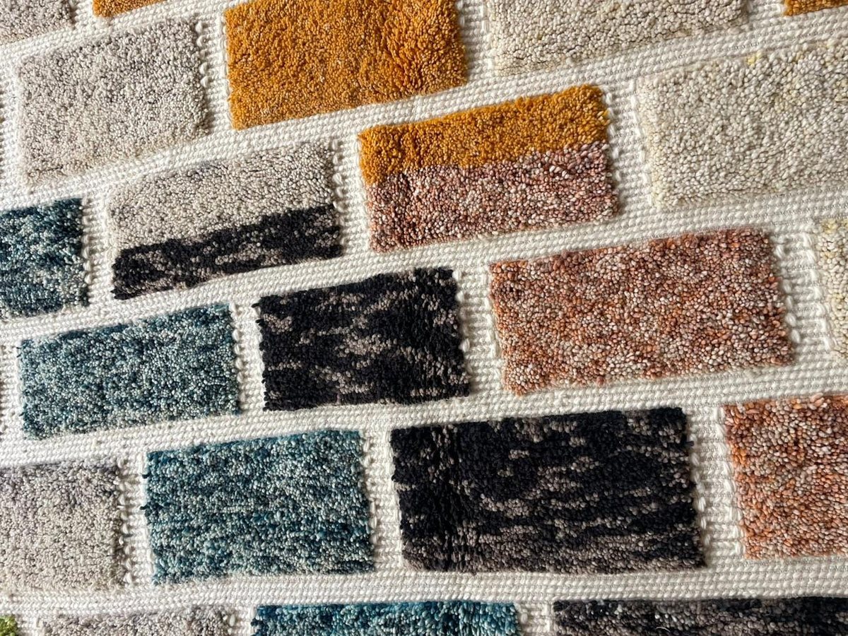 Close-up detail of a colorful Moroccan rug highlighting its varied colors and patterns.