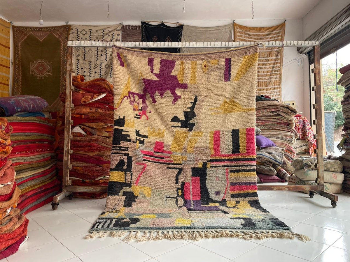 Lifestyle shot of a large colorful rug with decorative design on a natural background.