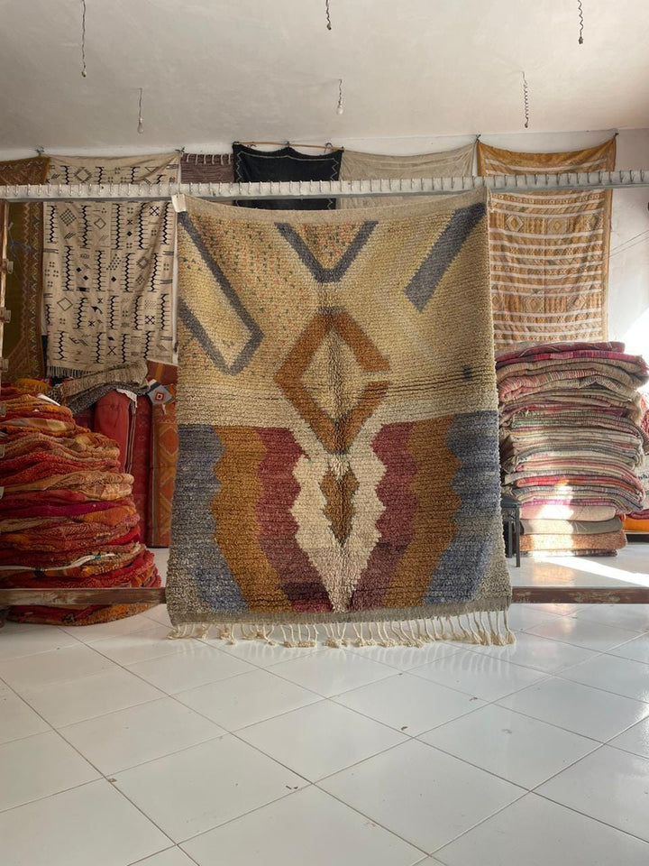 Lifestyle shot of a colorful Moroccan rug with geometric patterns on a natural background.