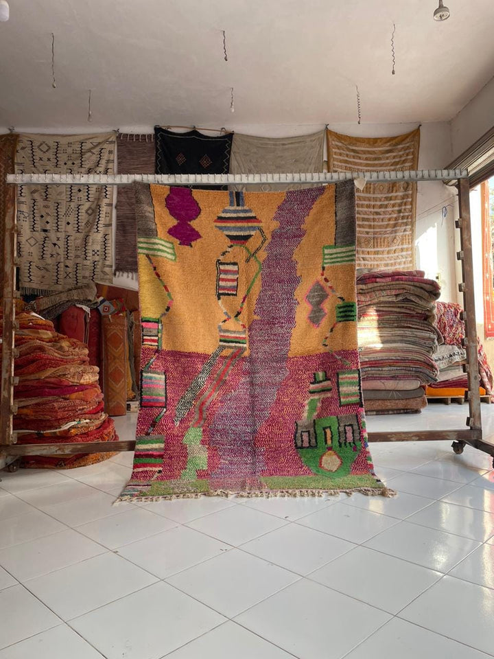 Lifestyle shot of a colorful Moroccan rug featuring bohemian style and textured fabric.