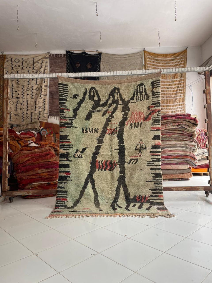 Lifestyle shot of a colorful Moroccan rug featuring geometric patterns on a natural background.